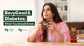A realistic Indian person enjoying a cup of BevyGood at home or work, with the BevyGood pack/cup visible. In the background, subtly show nutrition-label elements such as 0g Added Sugar and 5g Protein.